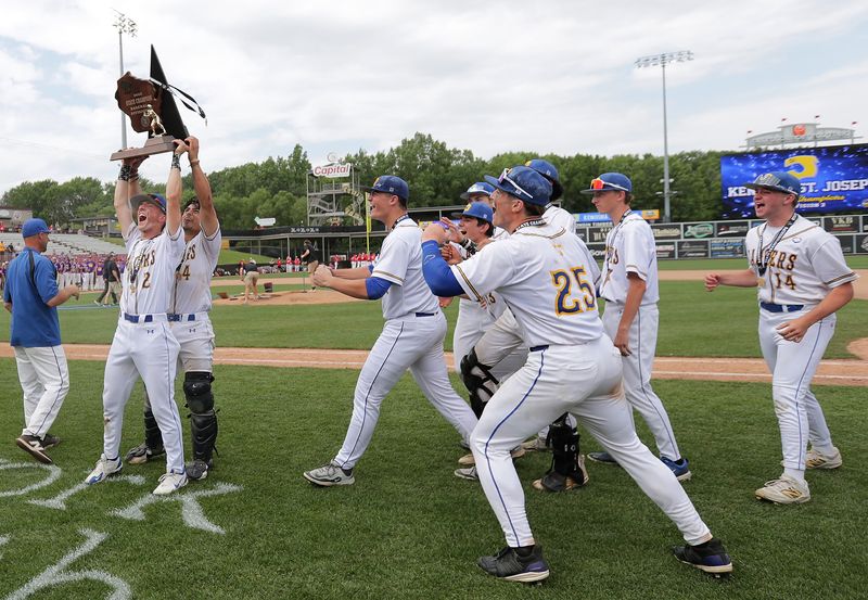 Kenosha St. Joseph players celebrate the team’s victory over Kewaunee in the WIAA Division 3 state title game at Fox Cities Stadium.