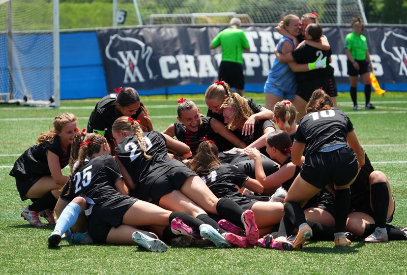 Muskego girls soccer players celebrate after winning the WIAA Division 1 girls state soccer championship, 3-0, in OT penalty kicks, over Madison West on Saturday, June 21, 2025 at Uihlein Soccer Park in Milwaukee, Wisconsin.