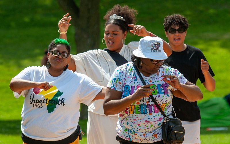 People dance during the Black-American Community Outreach’s celebration of Juneteenth, Saturday, June 21, 2025, at Kiwanis Park in Sheboygan, Wis.