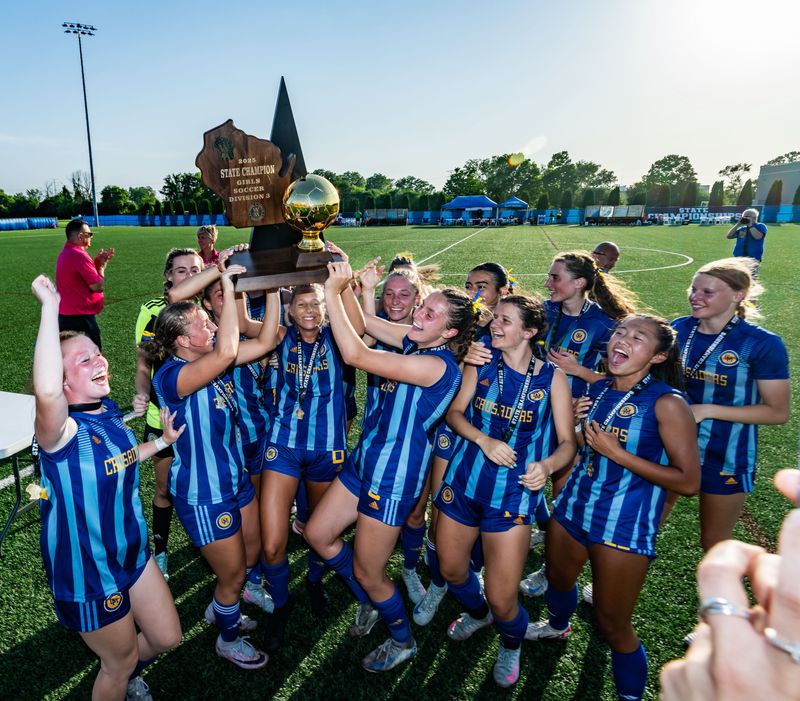 Catholic Memorial players celebrate with the gold trophy ball after winning the WIAA Division 3 girls state soccer championship, 4-2, over Edgewood on Saturday, June 21, 2025 at Uihlein Soccer Park in Milwaukee, Wisconsin.