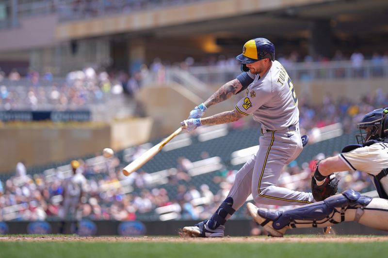 Brewers second baseman Brice Turang belts a three-run home run against the Twins in the fifth inning on June 22 at Target Field in Minneapolis.