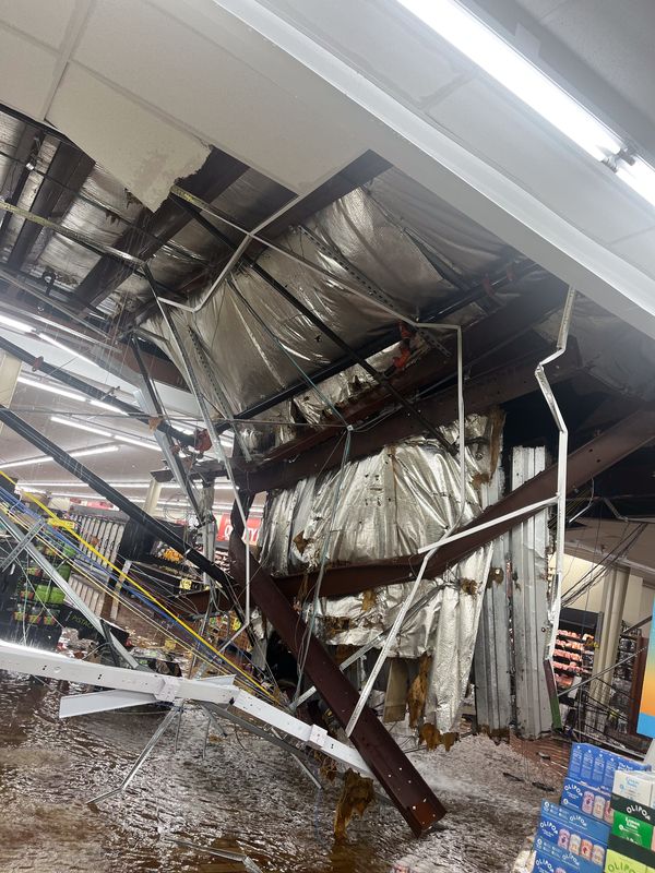 A roof partially collapsed and water poured through the ceiling at a Woodman's Food Market in Madison on June 23.