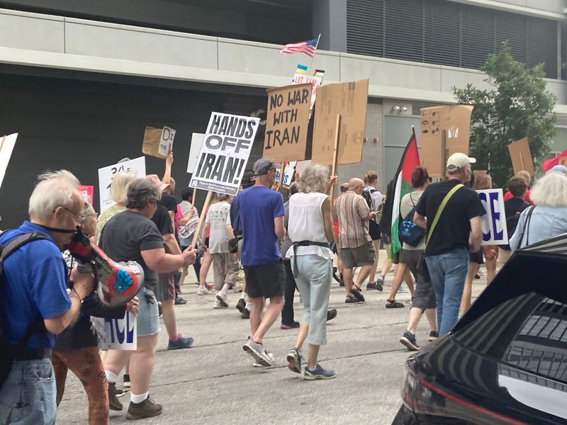 Antiwar protestors march in downtown Milwaukee on June 24, 2025.