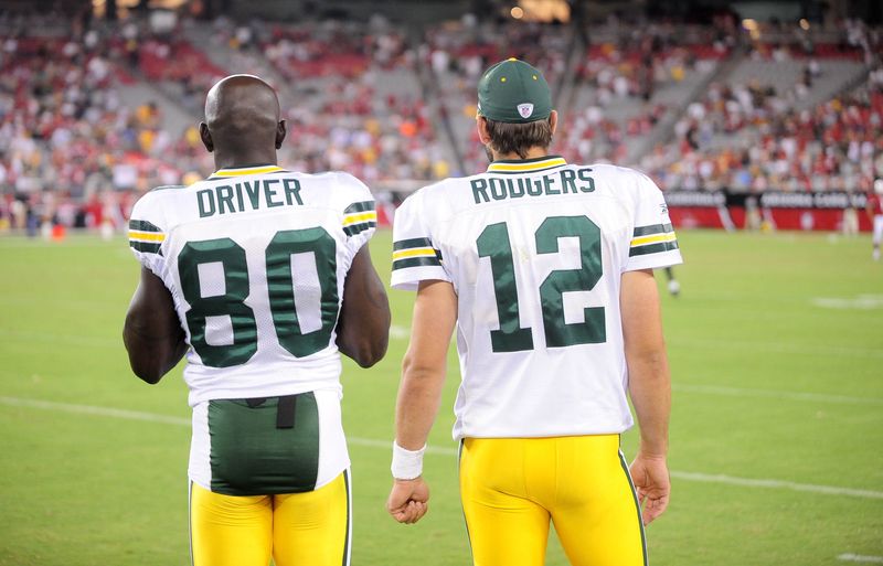 Aug. 28, 2009; Glendale, AZ, USA; Green Bay Packers wide receiver (80) Donald Driver stands alongside quarterback (12) Aaron Rodgers against the Arizona Cardinals during a preseason game at University of Phoenix Stadium. Mandatory Credit: Mark J. Rebilas-USA TODAY Sports
