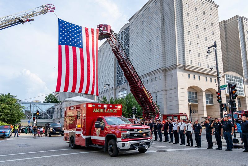 Milwaukee Fire Department raises a U.S. Flag as Milwaukee police officer Kendall Corder’s body is taken to the Milwaukee County Medical Examiner's office on Sunday June 29, 2025 in Milwaukee, WI. Officer Corder was given an End of Watch ceremony, he passed away on June 29 and was shot on June 26 while responding to a report of a subject with a gun.