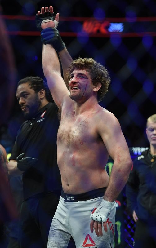 Mar 2, 2019; Las Vegas, NV, USA; Ben Askren (blue gloves) defeats Robbie Lawler (red gloves) during UFC 235 at T-Mobile Arena. Mandatory Credit: Stephen R. Sylvanie-USA TODAY Sports