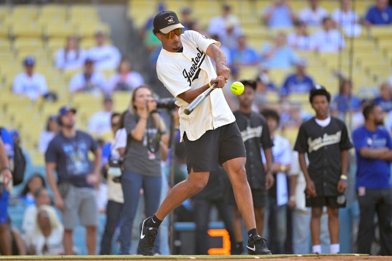Jun 19, 2025; Los Angeles, California, USA; Green Bay Packers quarterback Jordan Love (10) participates in Los Angeles Dodgers shortstop Mookie Betts (50) celebrity softball game prior to the game agains the San Diego Padres at Dodger Stadium. Mandatory Credit: Jayne Kamin-Oncea-Imagn Images