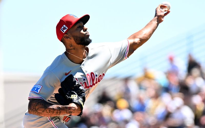 Philadelphia Phillies starting pitcher Christopher Sanchez (61) throws a pitch in the first inning against the Pittsburgh Pirates during spring training at LECOM Park.