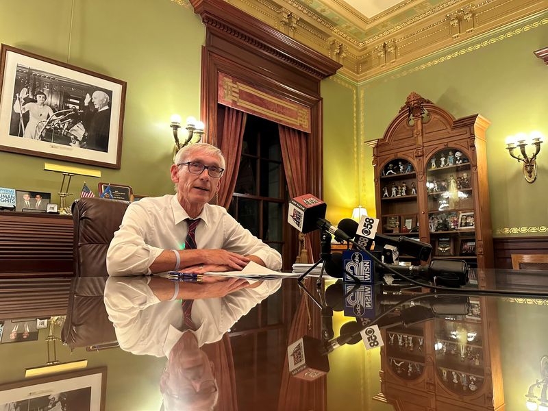 Gov. Tony Evers signs a new biennial Wisconsin state budget about 1:30 a.m. Thursday, July 3, after marathon sessions of the Assembly and Senate were held to approve the measure and send to Evers' desk.