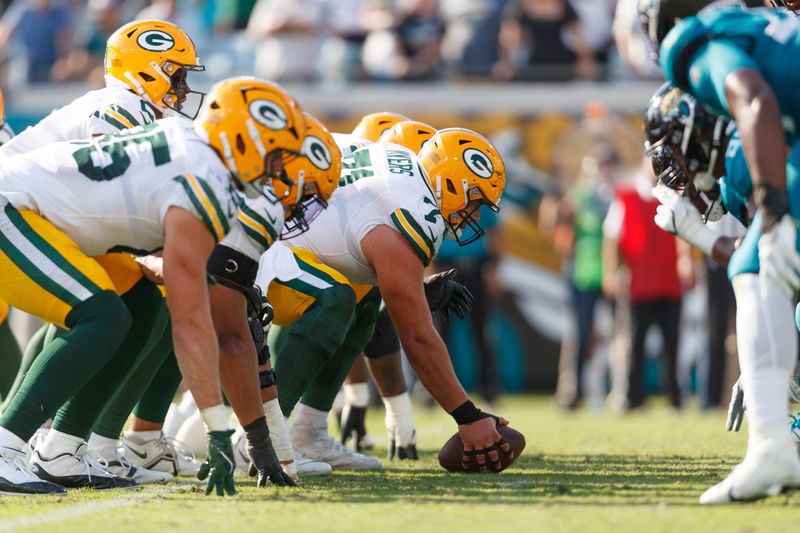 Oct 27, 2024; Jacksonville, Florida, USA; Green Bay Packers center Josh Myers (71) and the offensive line line up for the snap against the Jacksonville Jaguars during the fourth quarter at EverBank Stadium. Mandatory Credit: Morgan Tencza-Imagn Images