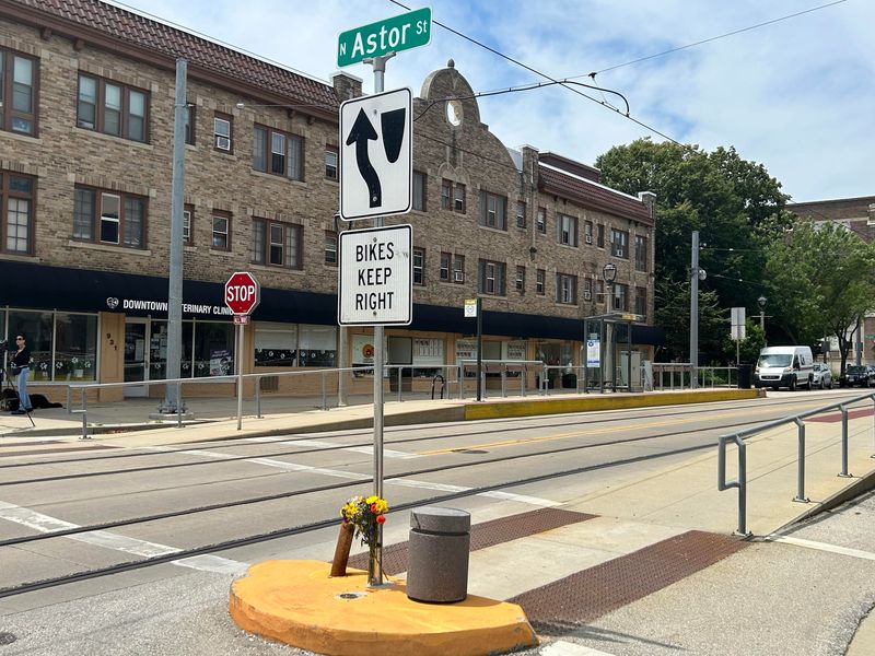 Flowers rest where a 62 year old was struck by a car and killed July 9 while crossing the intersection of East Ogden Avenue and North Astor Street.