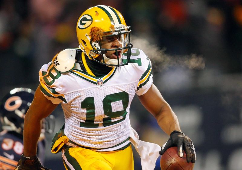 Dec 29, 2013; Chicago, IL, USA; Green Bay Packers wide receiver Randall Cobb (18) reacts to scoring the winning touchdown during the second half against the Chicago Bears at Soldier Field. Green Bay won 33-28. Mandatory Credit: Dennis Wierzbicki-USA TODAY Sports