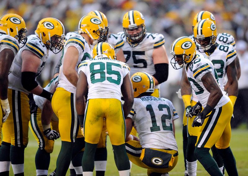 November 6, 2011; San Diego, CA, USA; Green Bay Packers quarterback Aaron Rodgers (12) talks in the huddle during the fourth quarter against the San Diego Chargers at Qualcomm Stadium. Mandatory Credit: Christopher Hanewinckel-USA TODAY Sports