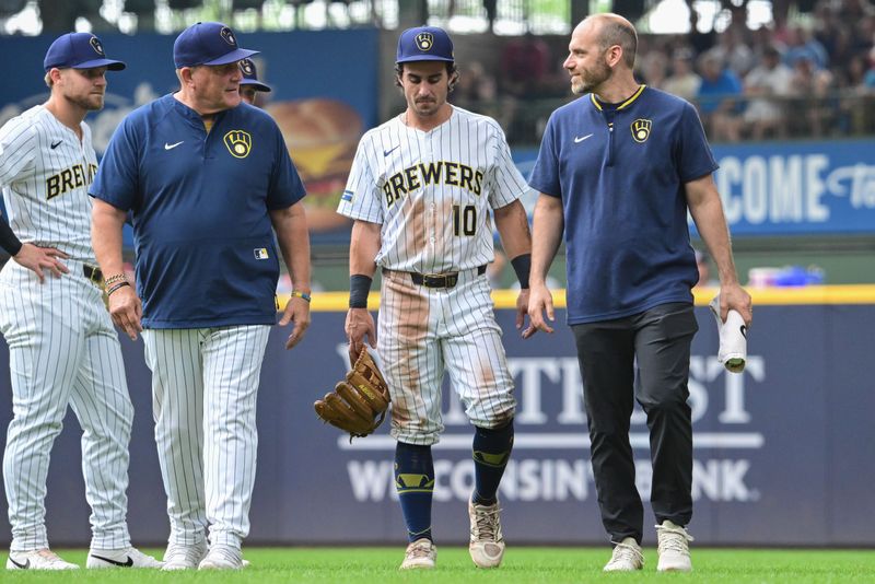 Brewers right fielder Sal Frelick leaves the game against the Nationals on July 13 flanked by manager Pat Murphy and one of the team's athletic trainers after suffering a hamstring injury in the third inning at American Family Field.