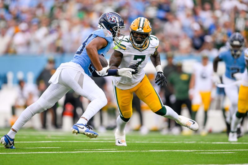 Sep 22, 2024; Nashville, Tennessee, USA; Green Bay Packers linebacker Quay Walker (7) tackles Tennessee Titans wide receiver Tyler Boyd (83) during the first half at Nissan Stadium. Mandatory Credit: Steve Roberts-Imagn Images