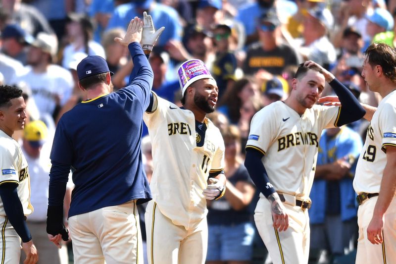 Jul 9, 2025; Milwaukee, Wisconsin, USA; The Milwaukee Brewers celebrate a walk-off single by center fielder Jackson Chourio during the tenth inning against the Los Angeles Dodgers at American Family Field. Mandatory Credit: Patrick Gorski-Imagn Images