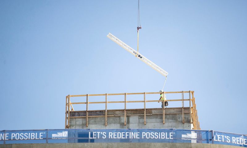A steel beam tumbled during the 'topping off' ceremony for the new home of the Milwaukee public museum July 15, 2025.