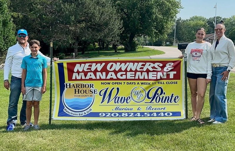 Randy Schmiedel, left, the new co-owner with Kraig Sadownikow of Wave Pointe Marina & Resort in Sturgeon Bay, visits the resort with his son, Caden; daughter, Veanna; and wife, Jane.