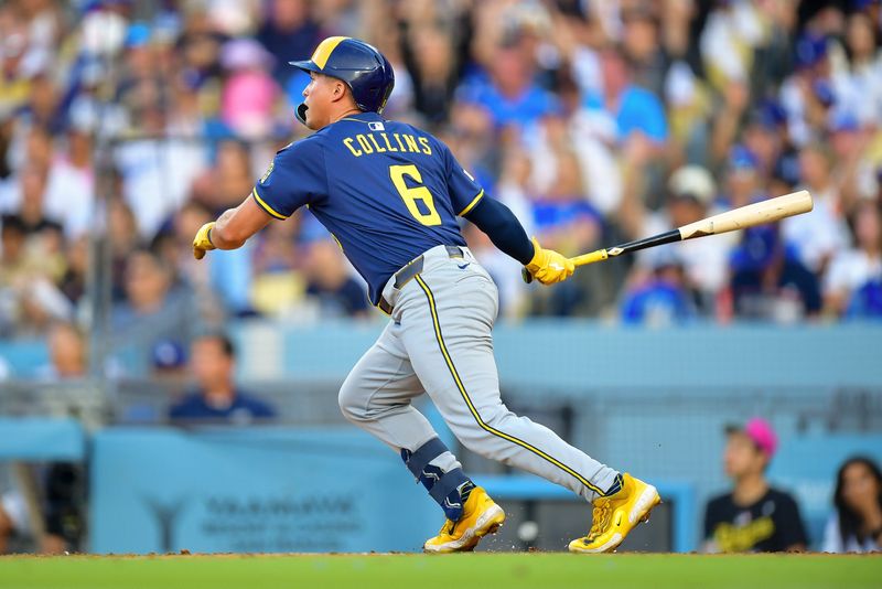 Jul 19, 2025; Los Angeles, California, USA; Milwaukee Brewers left fielder Isaac Collins (6) hits a solo home run against the Los Angeles Dodgers during the fourth inning at Dodger Stadium. Mandatory Credit: Gary A. Vasquez-Imagn Images