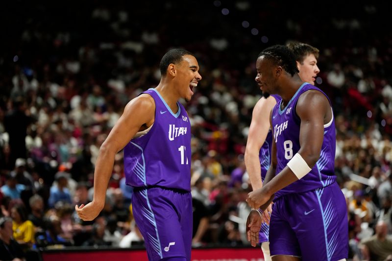 Jul 14, 2025; Las Vegas, NV, USA; Utah Jazz forward John Tonje (17) celebrates with guard Isaiah Collier (8) after scoring against the San Antonio Spurs during the second half of a NBA basketball game at the Thomas & Mack Center. Mandatory Credit: Lucas Peltier-Imagn Images