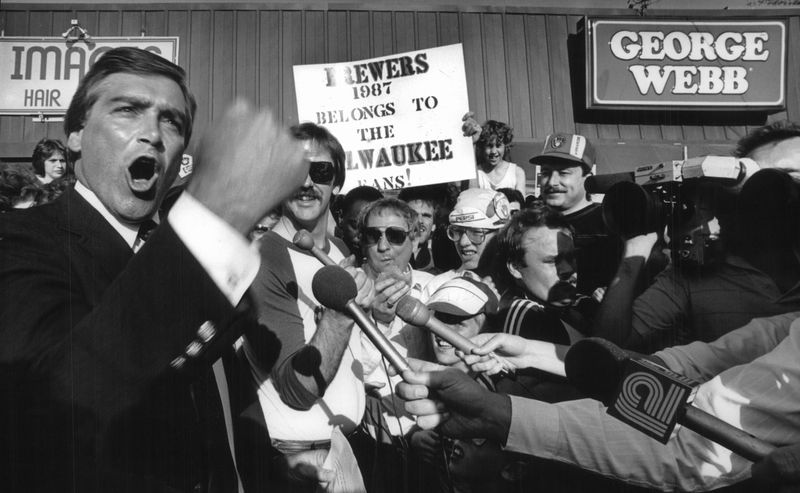 George Webb president David Stamm (above left) put in an extra cheer for the Milwaukee Brewers in April, 1987, as he announced the restaurant’s plans to pay off on a long-standing prediction by company founder George Webb that the hometown team would win 12 games in a row.