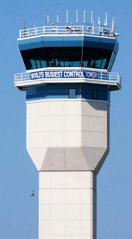The control tower features a sign telling the world it is the busiest control tower this week during the opening day of EAA AirVenture 2025 at Wittman Regional Airport, Monday, July 21, 2025, in Oshkosh, Wis.