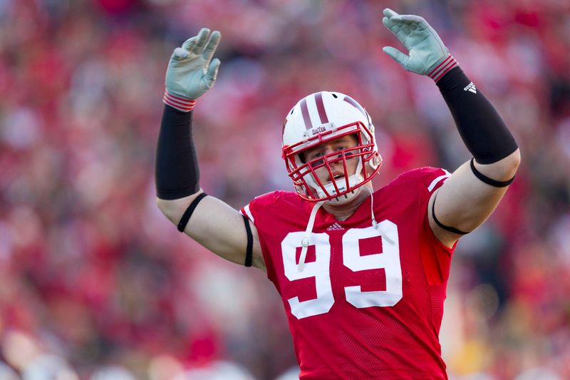 Nov 27, 2010; Madison, WI, USA; Wisconsin Badgers defensive tackle J.J. Watt (99) fires up the crowd prior to the game against the Northwestern Wildcats at Camp Randall Stadium. Wisconsin defeated Northwestern 70-23. Mandatory Credit: Jeff Hanisch-USA TODAY Sports