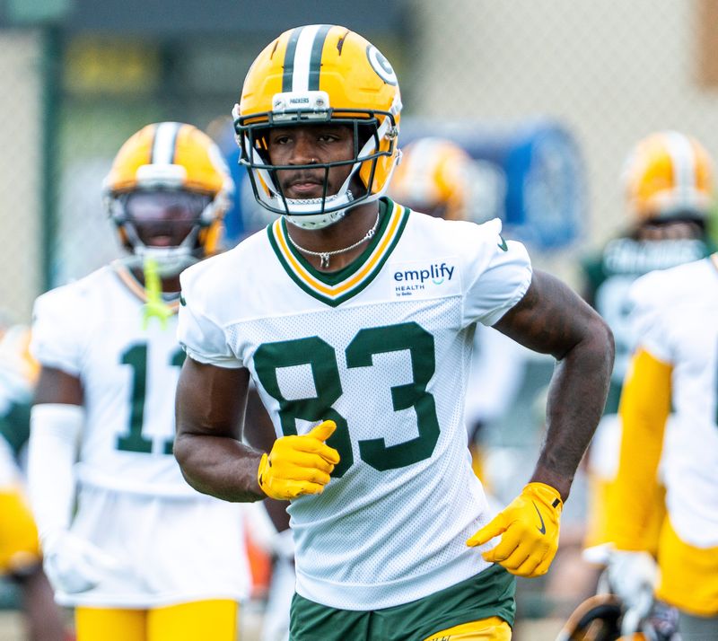 Green Bay Packers wide receiver Savion Williams (83) runs through a drill during the second day of training camp on Thursday, July 24, 2025, at Ray Nitschke Field in Ashwaubenon, Wis.