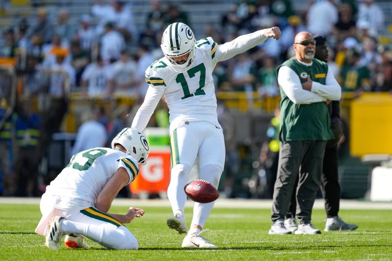Oct 20, 2024; Green Bay, Wisconsin, USA; Green Bay Packers kicker Brandon McManus (17) kicks a football during warmups prior to the game against the Houston Texans at Lambeau Field. Mandatory Credit: Jeff Hanisch-Imagn Images