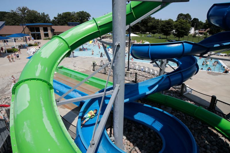 Children have fun on the waterslide at Erb Pool Monday, July 28, 2025, in Appleton, Wisconsin.