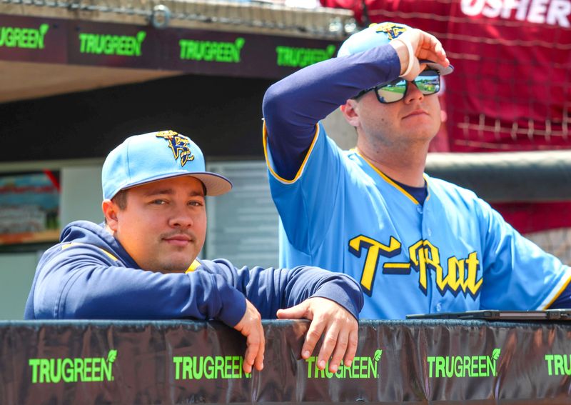 Evan Berliner, left, is in his first season as hitting coach with the Wisconsin Timber Rattlers.