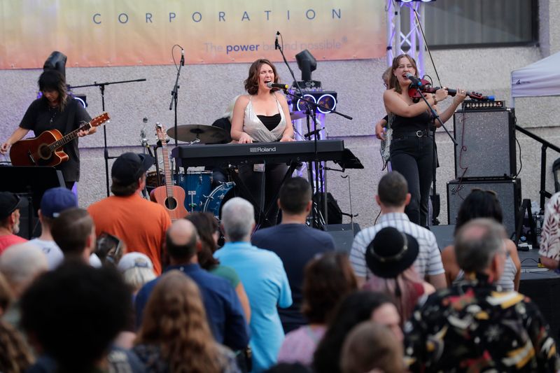 Kate Stenson and Jennifer Harlee perform at the Hilton Paper Valley courtyard during the 12th annual Mile of Music festival Friday, August 1, 2025, in downtown Appleton, Wisconsin.