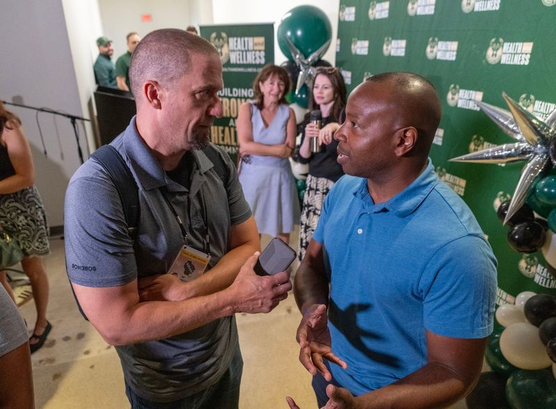 ATWORK - Milwaukee Journal Sentinel Bucks reporter Jim Owczarski interviews Milwaukee Mayor Cavalier Johnson at the opening of the Milwaukee Bucks Health and Wellness clinic in Milwaukee on Aug. 6, 2025. The clinic, formed by Bucks co-owner Wes Edens, Bucks Health and Wellness Medical Director Elizabeth Sharp, M.D., and the Milwaukee Bucks Foundation offers a free medical program designed to prevent and treat obesity within underserved populations of Milwaukee.