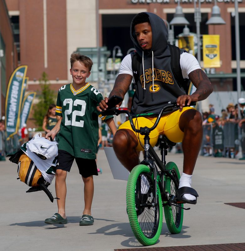 Green Bay Packers wide receiver Matthew Golden rides a young fan’s bicycle to practice on Wednesday, August 6, 2025, at Lambeau Field in Green Bay, Wis. 
Tork Mason/USA TODAY NETWORK-Wisconsin