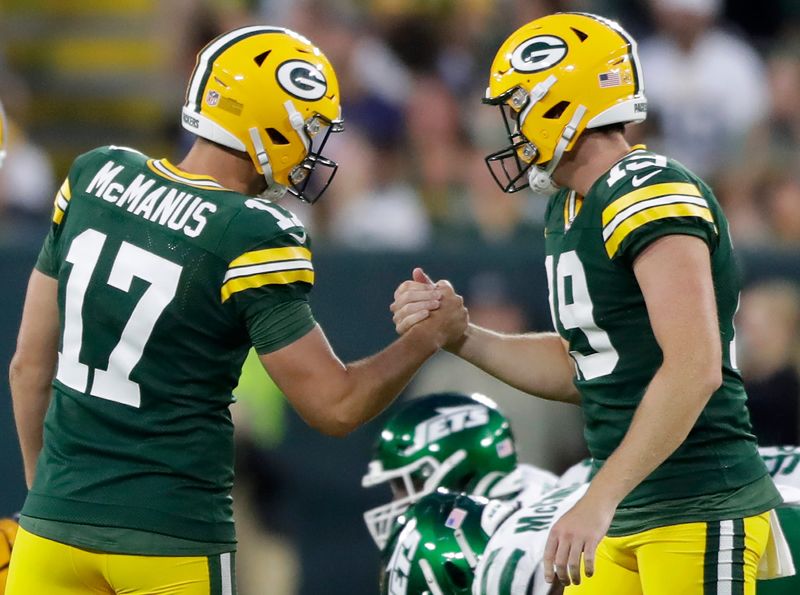 Green Bay Packers kicker Brandon McManus and his holder, punter Daniel Whelan, celebrate a field goal against the New York Jets.