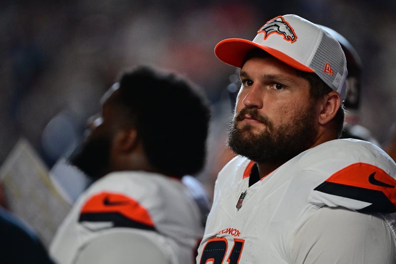 Aug 11, 2024; Indianapolis, Indiana, USA; Denver Broncos defensive end Matt Henningsen (91) stands near the bench before the game against the Indianapolis Colts at Lucas Oil Stadium. Mandatory Credit: Marc Lebryk-USA TODAY Sports