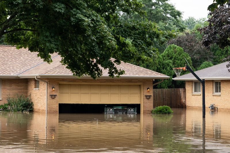 Flooded homes seen on W Argonne Drive after overnight storms in Wauwatosa on the morning of Aug. 10, 2025.