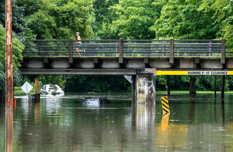 A car is seen submerged in water on N Milwaukee River Pkwy on Sunday August 10, 2025 in Milwaukee, WI.