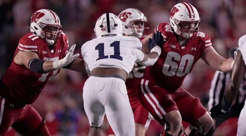 Wisconsin offensive lineman Riley Mahlman (71) and offensive lineman Joe Huber (60) are shown during the third quarter of their game Saturday, October 26, 2024 at Camp Randall Stadium in Madison, Wisconsin. Penn State beat Wisconsin 28-13.