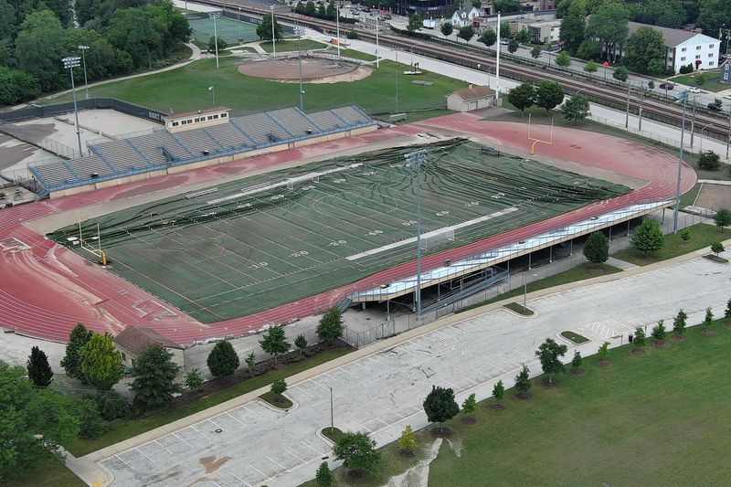 The turf football field and surrounding track at Hart Park in Wauwatosa are in a state of disrepair on Monday, Aug. 11, 2025, after heavy rainfall caused flooding in the Milwaukee area over the weekend.