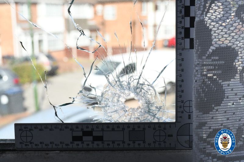 A hole left in the window of home in Birmingham, England. A UK court found Aimee Betro, 45, of West Allis, guilty of participating in a failed 2019 murder-for-hire plot. Prosecutors say she fired the shot that nearly killed a man she was contracted to kill.