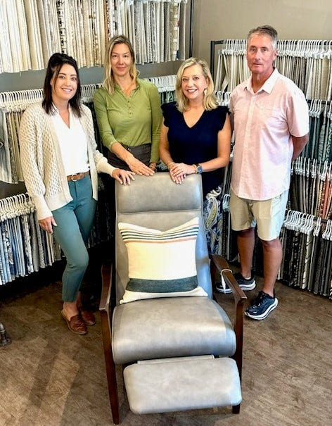 Designer Lindsey Penning, design assistant Willow Pfeiffer and co-owners Polly and Don Helm of Designworks in Egg Harbor show the MotionCraft genuine leather recliner valued at $3,750 that the store is raffling off to raise funds for them to help furnish the 50th home build for Door County Habitat for Humanity. The raffle winner has the option of taking the chair or a $1,000 gift certificate to the store.