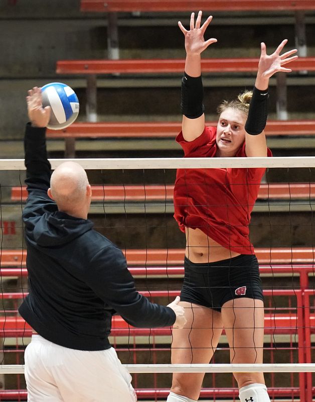 Wisconsin head coach Kelly Sheffield works with Anna Smrek during volleyball practice on August 22, 2022, in Madison, Wis. Wisconsin will be defending their NCAA national championship this season.
