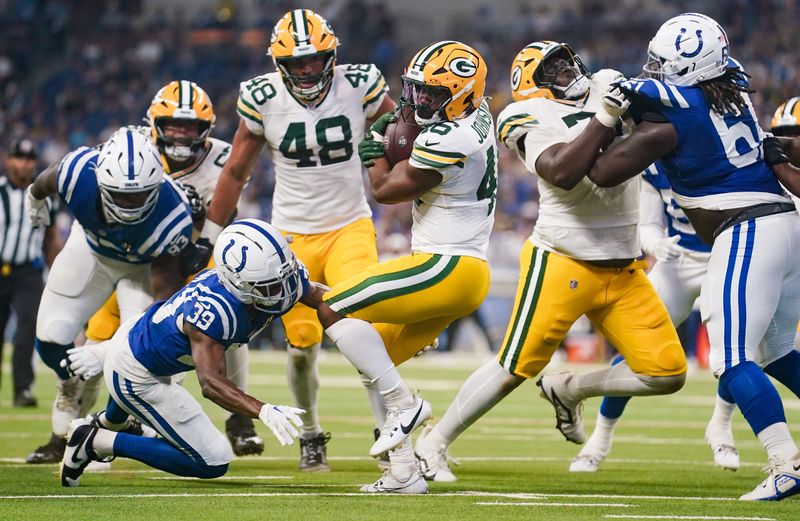Aug 16, 2025; Indianapolis, Indiana, USA; Green Bay Packers running back Amar Johnson (46) runs for a touchdown past Indianapolis Colts cornerback Alex Johnson (39) during the second half at Lucas Oil Stadium. Mandatory Credit: Robert Goddin-Imagn Images