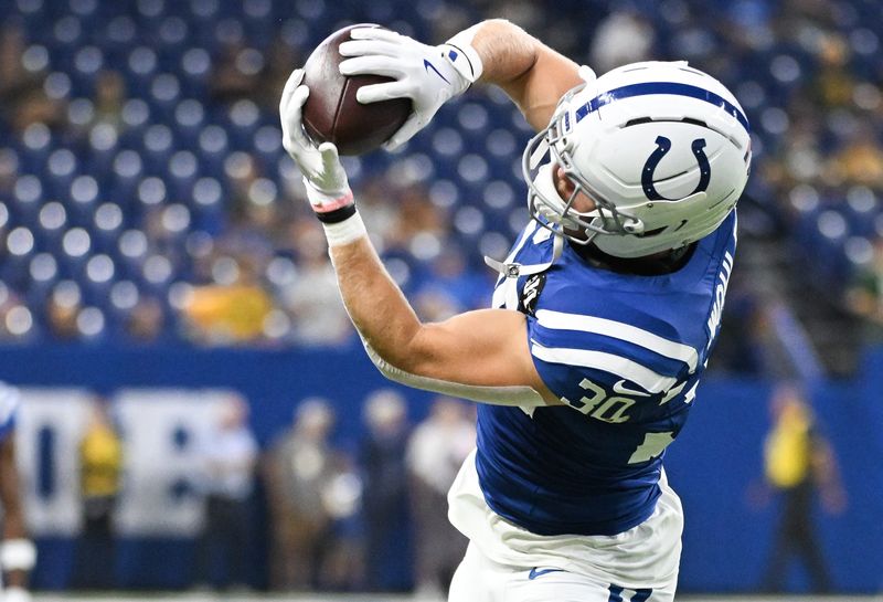 Aug 16, 2025; Indianapolis, Indiana, USA; Indianapolis Colts safety Hunter Wohler (30) catches a pass during warmups prior to the game against the Green Bay Packers at Lucas Oil Stadium. Mandatory Credit: Robert Goddin-Imagn Images