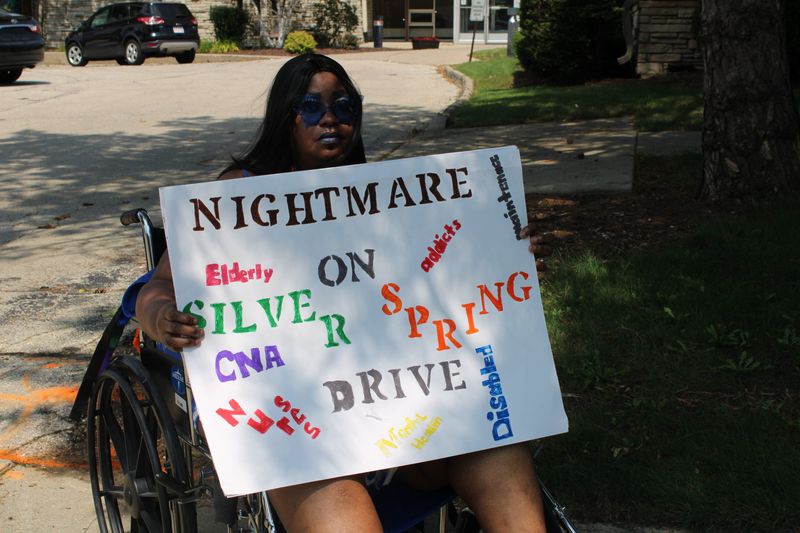 Lettie Burks, 49, a resident of Silver Springs Health Care Center in Glendale, organized a protest outside the facility to raise awareness for what she sees as intolerable living conditions on Aug. 15, 2025.