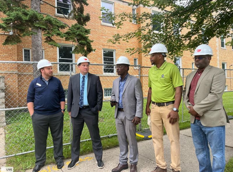 Milwaukee County Executive David Crowley with James Mathy, Housing Administrator for the Milwaukee County Department of Health and Human Services and Anthony Kazee, Principal of KG Development Group.