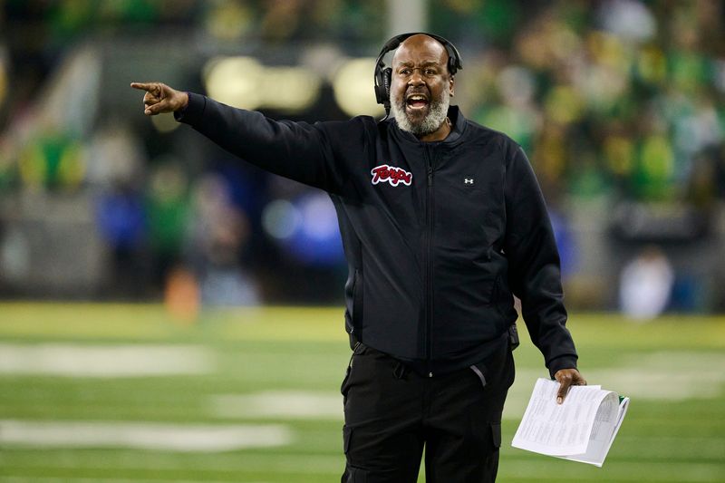 Maryland Terrapins head coach Mike Locksley questions a call.