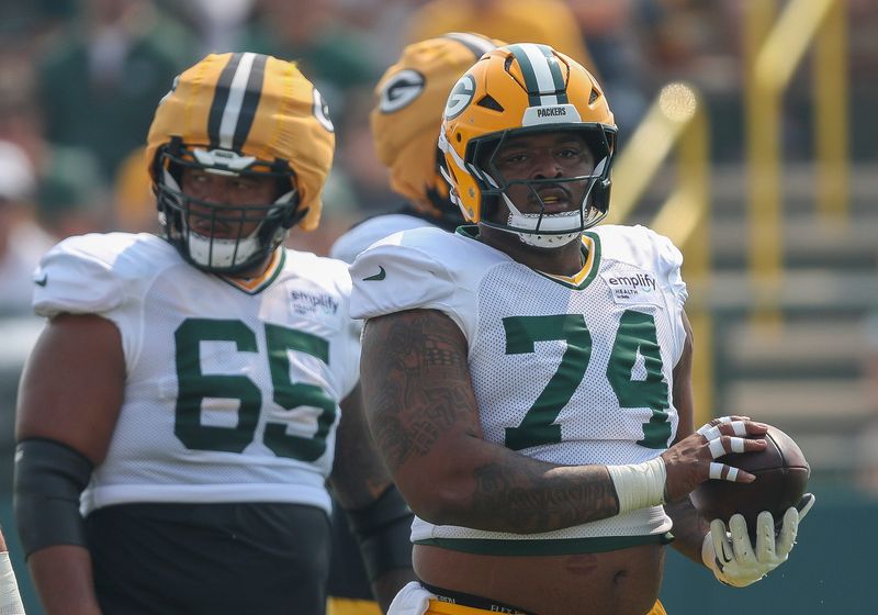 Green Bay Packers center Elgton Jenkins (74) catches a ball between practice reps on Thursday, July 31, 2025, at Ray Nitschke Field in Ashwaubenon, Wis.
Tork Mason/USA TODAY NETWORK-Wisconsin
