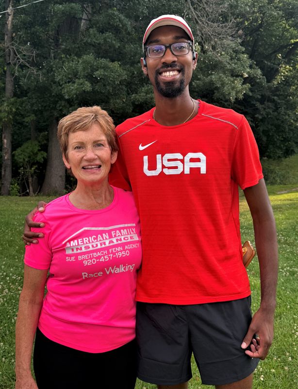 Sue Breitbach-Fenn and Olympian Jordan Crawford pose after a recent competitive walking training session at Telulah Park in Appleton.